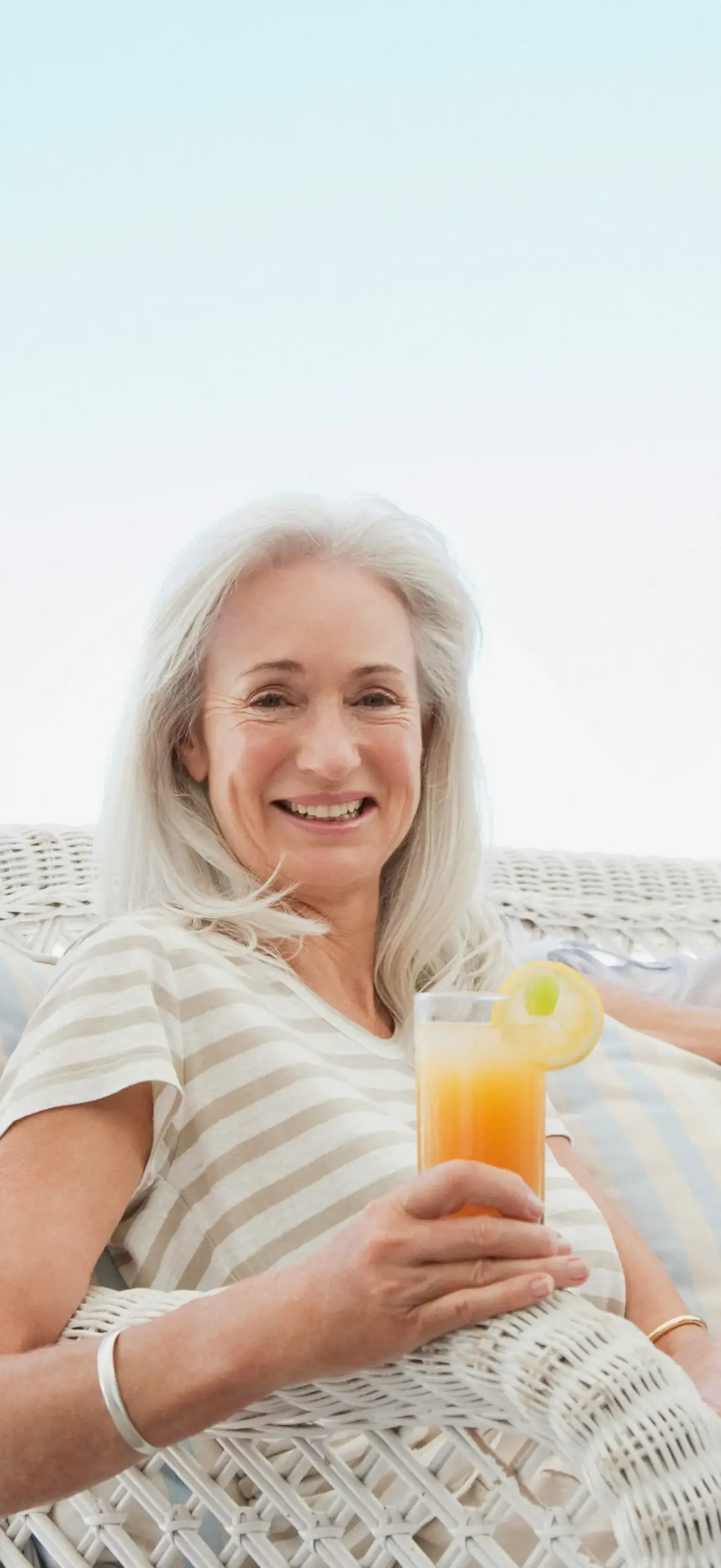 woman with a glass of juice in her hand